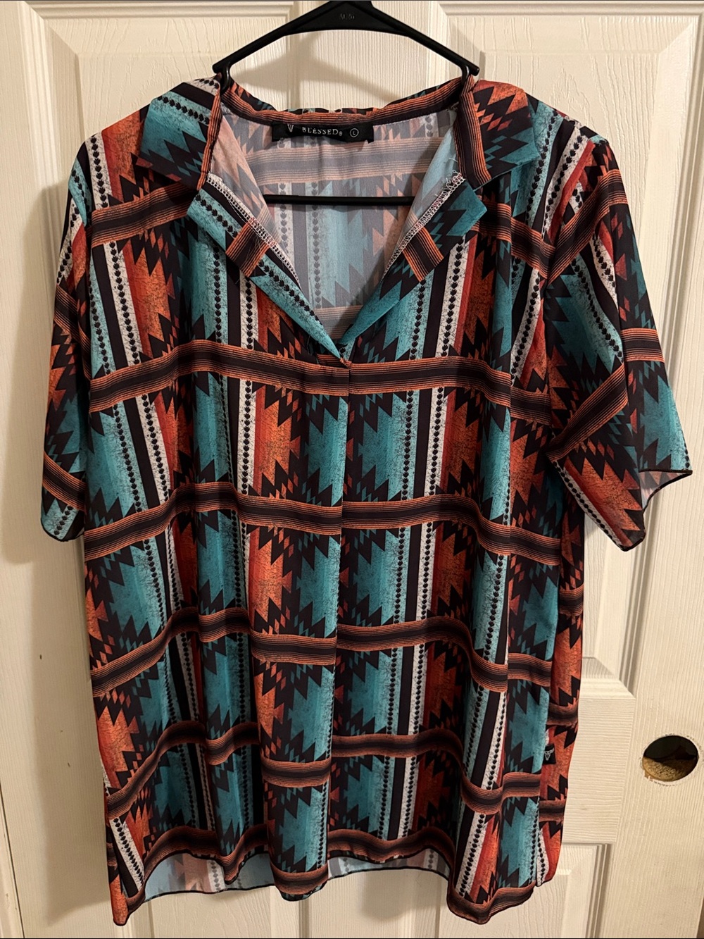 Lucky & Blessed Men’s Short Sleeve Geo-Print Polo in Teal & Rust
